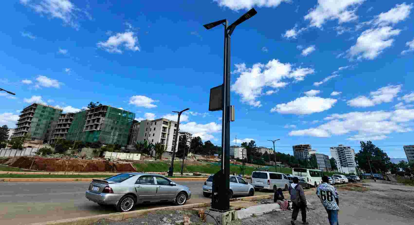 Smart city street with IoT-connected LED lighting and sensor nodes